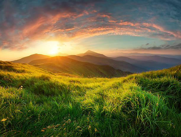 Sunrise in the mountain valley in the summer time. Beautiful natural landscape